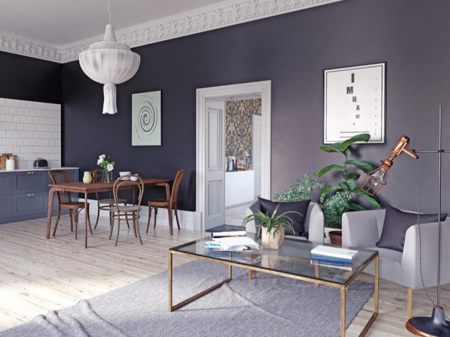 Modern_open_plan_interior_dark_grey_walls_white_ceiling_grey_couch_plant_glass_table 